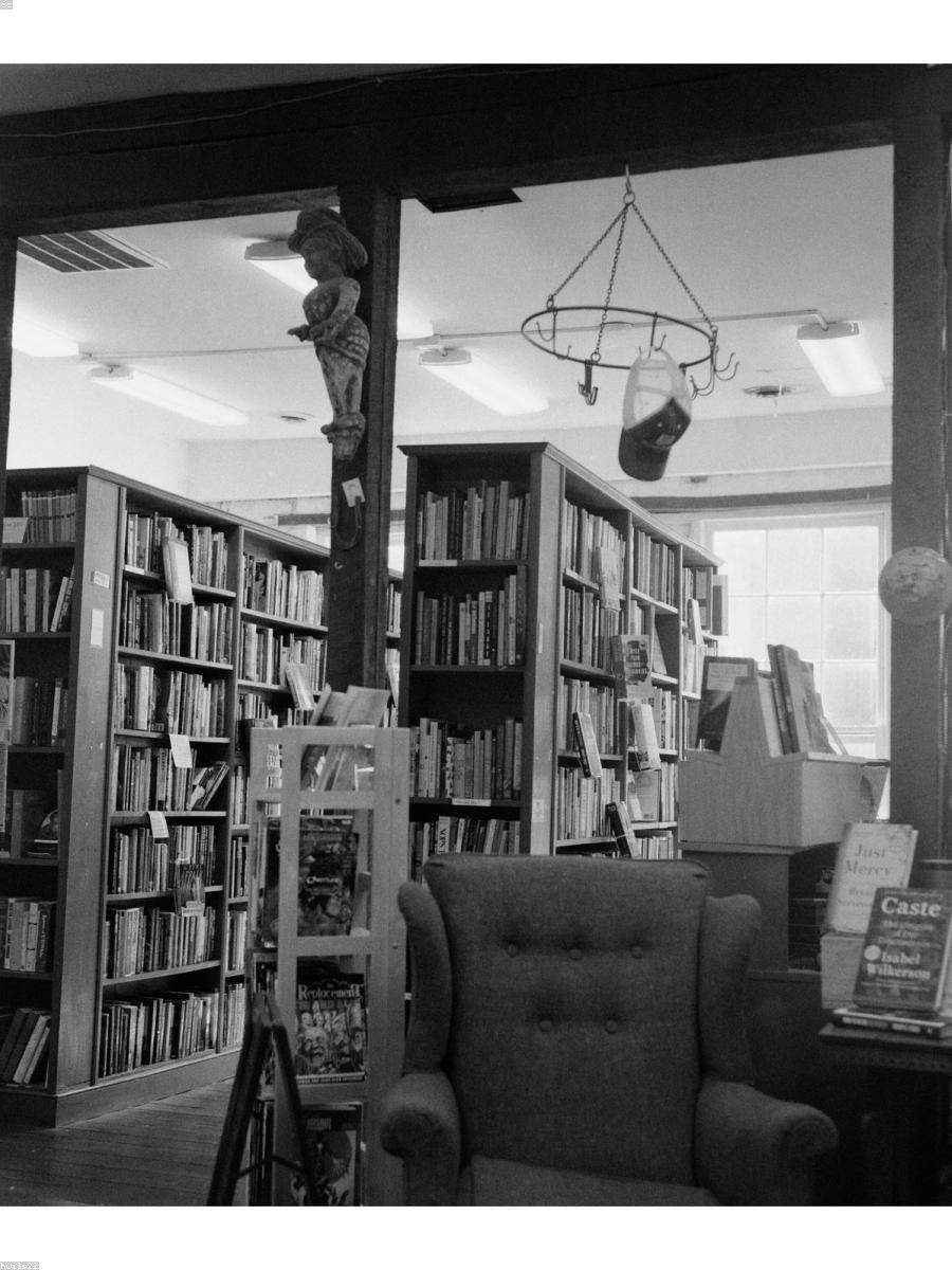 Library shelving — to be replaced with a real photograph from Pradeep's practice
